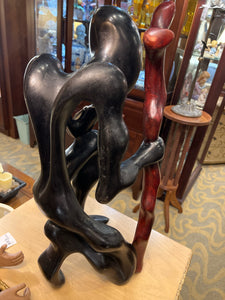 Large African Man Kneeling With Cane